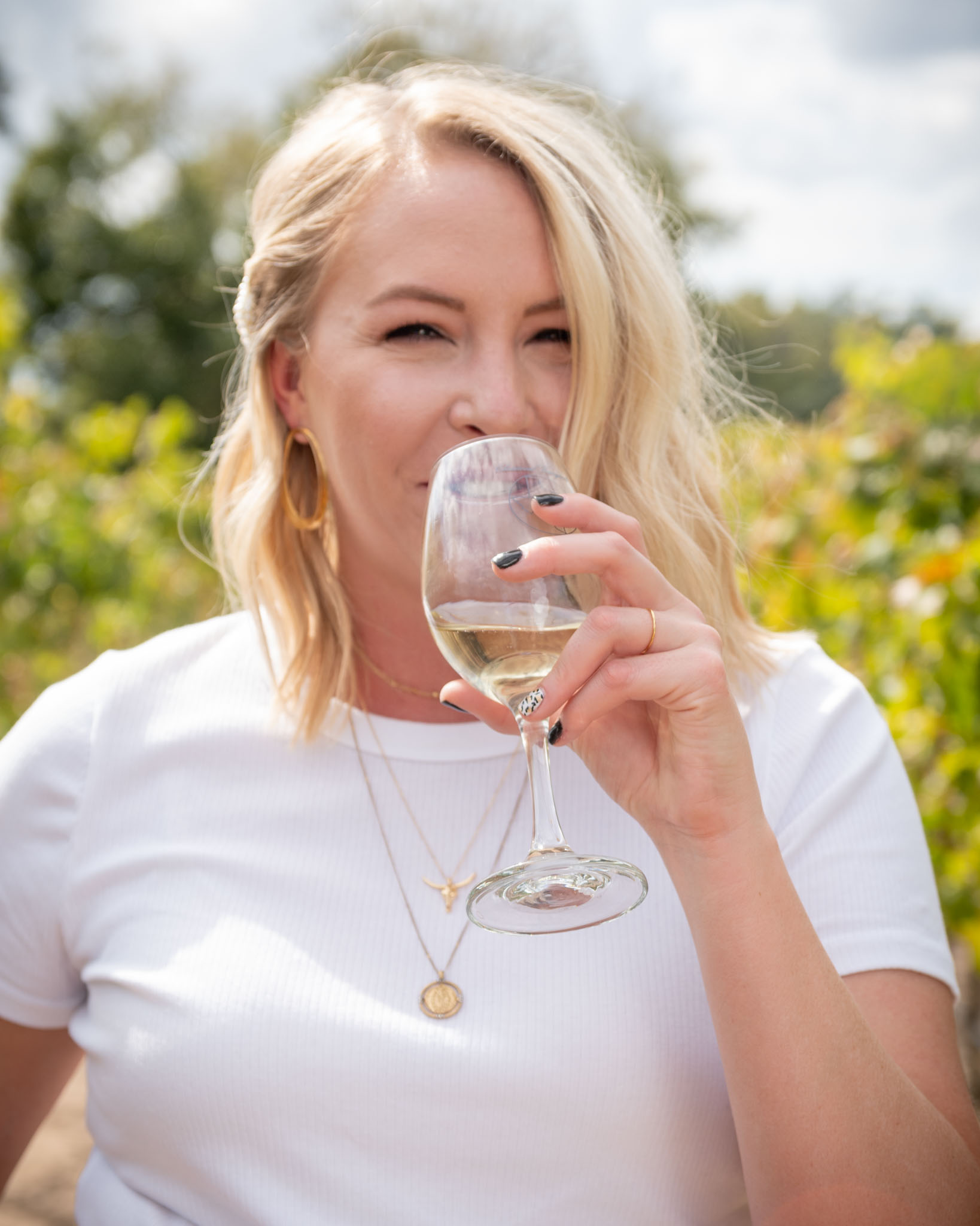 Businesswoman drinking from large wine glass with straw stock photo  (213501) - YouWorkForThem